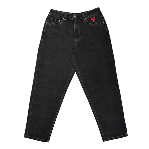 The Bluetile Skateboards BLUETILE BRAND DENIM RUTLEDGE PANT BLACK is a loose-fit black denim with a red heart patch embroidered on the front right pocket, shown against a white background.