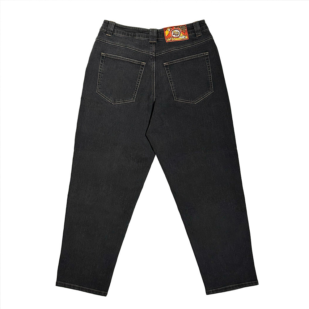 Back view of Bluetile Skateboards BLUETILE BRAND DENIM RUTLEDGE PANT BLACK, a loose fit denim with two rear pockets and a leather waistband patch featuring a red and orange design.