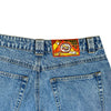 Back view of BLUETILE BRAND DENIM RUTLEDGE PANT BLUE by Bluetile Skateboards, 100% cotton, with a colorful "LIVE TITE JEAN DENIM" patch featuring a graphic above the right pocket.