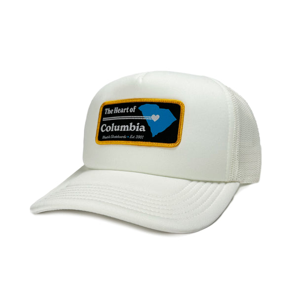 A BLUETILE "HEART OF COLUMBIA" TRUCKER ECRU cap with a patch on it by Bluetile Skateboards.