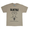 The BLUETILE NEVER GO TO COLLEGE TEE BONE by Bluetile Skateboards is made from heavyweight cotton, featuring "BLUETILE," a cartoon person with glasses and tie, and "NEVER GO TO COLLEGE" printed below.