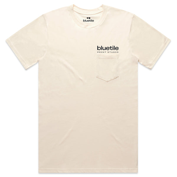 BLUETILE PRINT STUDIO POCKET TEE ECRU by Bluetile Skateboards, made from combed cotton in an off-white shade, includes a pocket and displays the phrase "BLUETILE PRINT STUDIO" on the front.