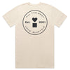 The BLUETILE PRINT STUDIO POCKET TEE ECRU by Bluetile Skateboards is crafted from heavy-weight cotton and available in ecru. It features a circular logo on the back, adorned with a heart and square, alongside hand screen printed text reading "All the Best, Love, Bluetile," and "Est. 2001.