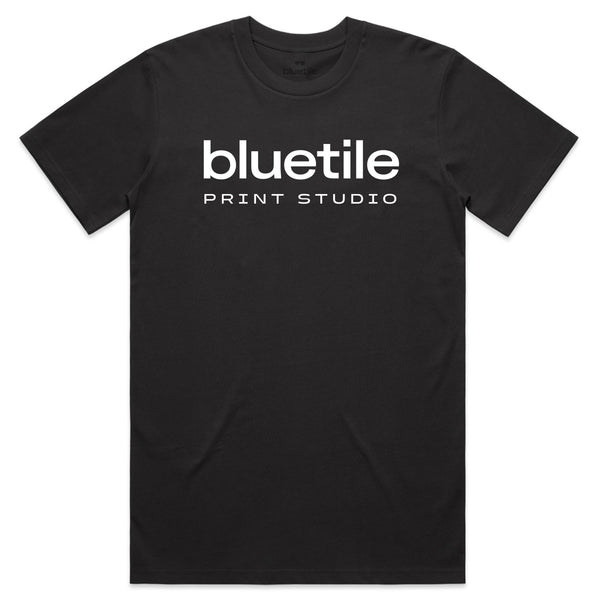 Coal-colored T-shirt designed by Jay Croft with the "BLUETILE PRINT STUDIO" text in white, centered on the front, from Bluetile Skateboards.