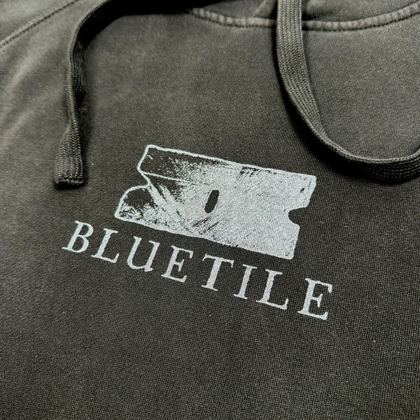 A BLUETILE "RAZOR" HOODIE FADED BLACK with the word Bluetile Skateboards on it.