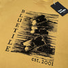 A yellow BLUETILE "RAZORS" TEE FADED MUSTARD t-shirt with the words Bluetile Skateboards on it.