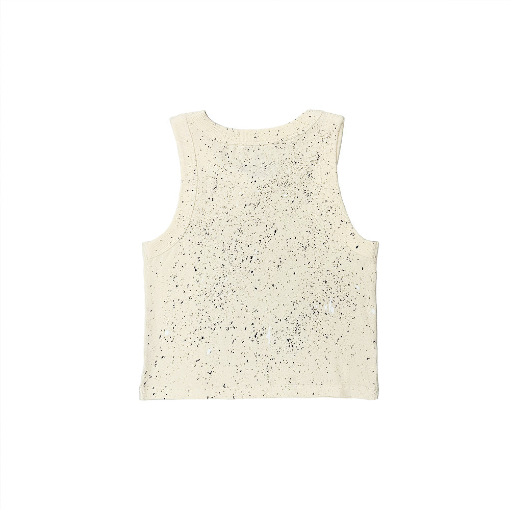 The BLUETILE HEART + SQUARE RIB CROP TANK ECRU by Bluetile Skateboards is a beige, sleeveless 100% cotton tank featuring a black speckled pattern, displayed flat and viewed from the back on a white background.
