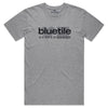 The "BLUETILE STACKED LOGO TEE HEATHER GREY" from Bluetile Skateboards is a natural gray tee with a black front logo, made of 100% cotton for lasting comfort.