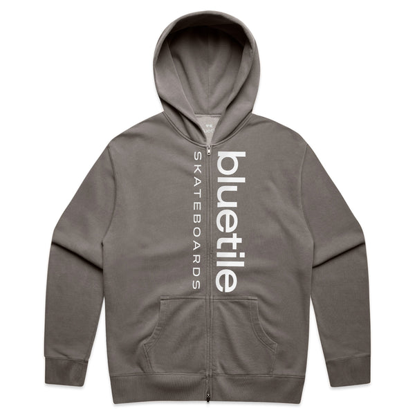 The BLUETILE LOGO DOUBLE ZIP HOODIE in faded grey by Bluetile Skateboards combines style and comfort, featuring a vertical logo on the front.