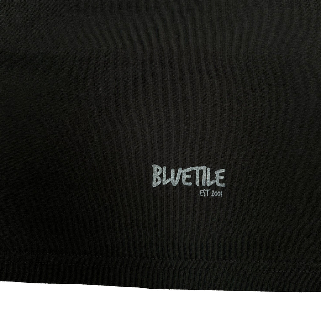 A black tee with the word "Bluetile Skateboards" on it.