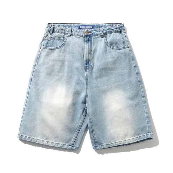 Carpet Co.'s BUTTER ROACH DENIM SHORTS DISTRESSED INDIGO feature a relaxed, baggy fit in faded indigo cotton denim with front and back pockets, belt loops, and button closure for a laid-back style.