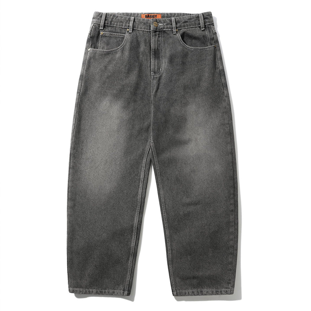 The Butter Goods Roach Denim Jeans in Black Wash feature a high-waisted, baggy fit with five pockets and belt loops, shown laid flat against a white background.