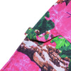 A close-up of CARPET CO. REALTREE PANT PINK fabric showcases pink, green, and brown patterns with a rectangular flap and looped tab by Carpet Co.