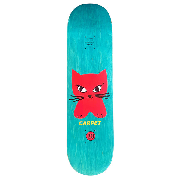 The CARPET CAT DECK by Carpet Co. is a limited edition turquoise skateboard featuring a large red cartoon cat face and yellow "CARPET" and "20" hand-screened graphics—making it truly unique.