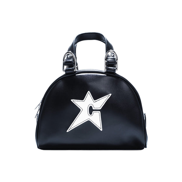 The Bluetile Skateboards CARPET CO. C-STAR PURSE BLACK is a chic black leather purse with two handles, silver buckles, and a white star-shaped “C” design on the front—perfect for any occasion.