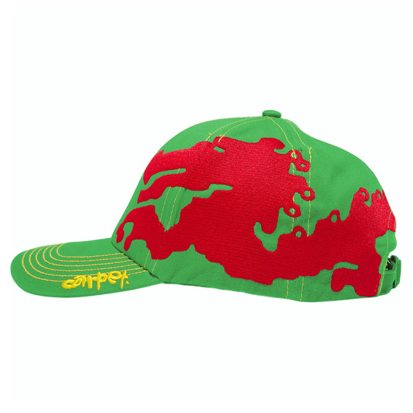 The CARPET CO. DRAGON HAT GREEN by Carpet Co. features an abstract red pattern on the side and yellow embroidered letters on the brim, making it a bold choice for standing out.