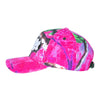 The CARPET CO. REALTREE HAT PINK by Carpet Co. is a pink and green tie-dye canvas baseball cap featuring an embroidered white eye patch on the front and an adjustable strap at the back.