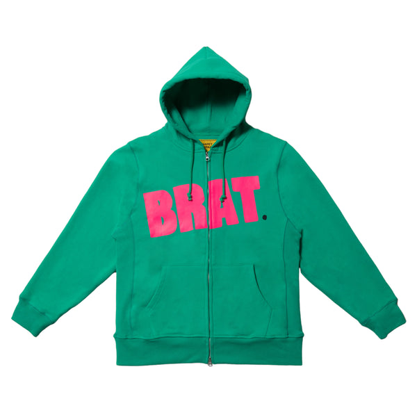 Green zip hoodie with the Carpet Co. brat logo in pink letters across the chest, displayed against a white background.