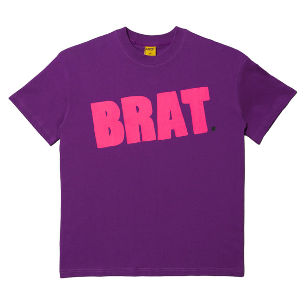 Carpet Co. purple t-shirt with the word "brat" screen printed in bold pink letters on the front, displayed on a plain background.
