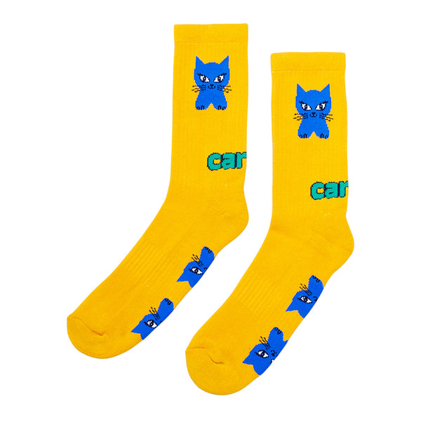The CARPET CO. CAT SOCK YELLOW by STANCE features a blue cat face and green and blue “cat” text, accented with playful kitty artwork.