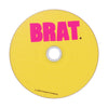 Yellow CARPET CO. BRAT DVD with the word "brat." in pink letters, branded with "©2024 carpet company" at the bottom and a strap back design.