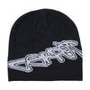 The Carpet Co. Freestyle Beanie Black is a cotton beanie with a bold white "carrot" logo across the front, inspired by the classic Freestyle Beanie design.