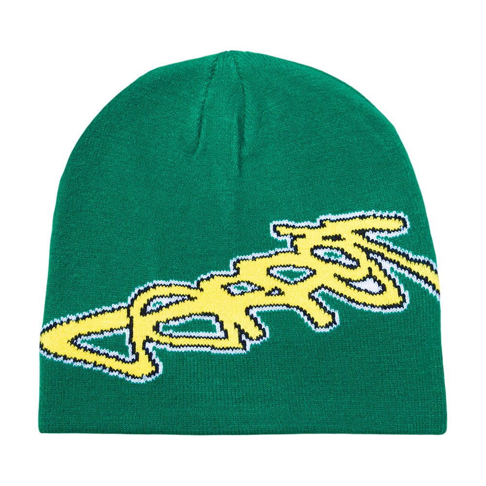 The CARPET CO. FREESTYLE BEANIE GREEN by Carpet Co. is a green cotton beanie featuring a large yellow and white stylized graphic text on the front in signature freestyle beanie style.