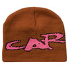 A brown and pink CARPET NO FOLD BEANIE BROWN with the word Carr on it. Made of cotton. (Brand: Carpet Co.)