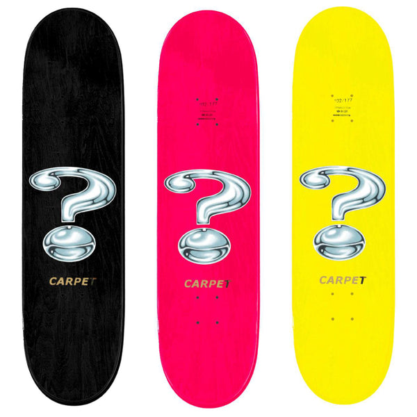 Three Carpet Co. skateboards with base colors and a CARPET COMPANY QUESTION on them.