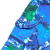 Close-up of a fabric with an abstract, multicolored pattern in blue, green, and white, featuring overlapping shapes and textures reminiscent of the vibrant designs in Carpet Co.'s REALTREE PANT BLUE.