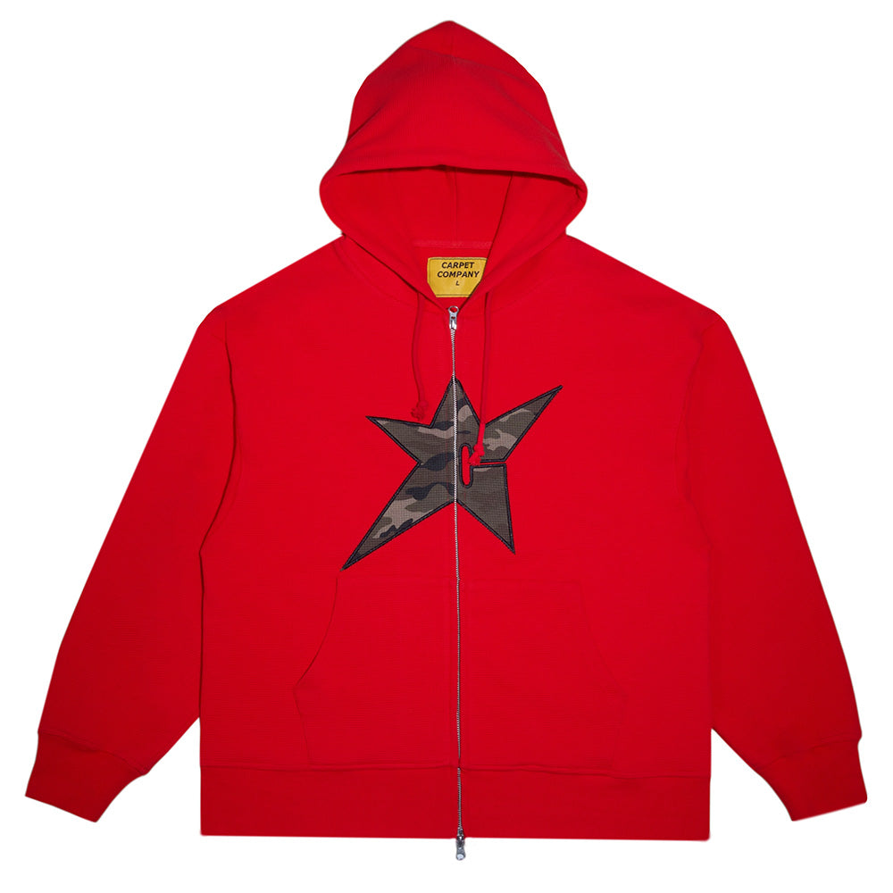 The Carpet Co. C-Star Thermal Zip Hoodie Red features front pockets, a black camo star chest graphic, signature Carpet Co. details, and a visible yellow inner label for standout style.