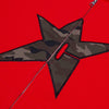 A close-up of the Carpet Co. C-Star Thermal Zip Hoodie Red shows its red fabric, a black-bordered camo star patch, and a visible silver zipper down the center.
