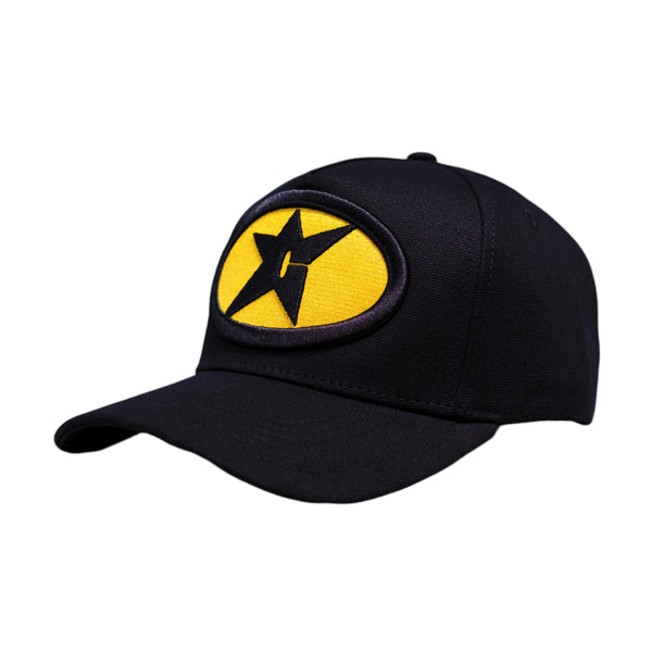 The Carpet Co. CARPET GAS STATION HAT BLACK features a yellow oval patch with a black star and lightning bolt design on the front.