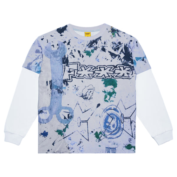 The CARPET RAG TEE LONG SLEEVE by Carpet Co. showcases abstract blue, green, and gray graphic designs with wrench and geometric motifs on the front, complemented by a subtle yellow print for an added pop of color.