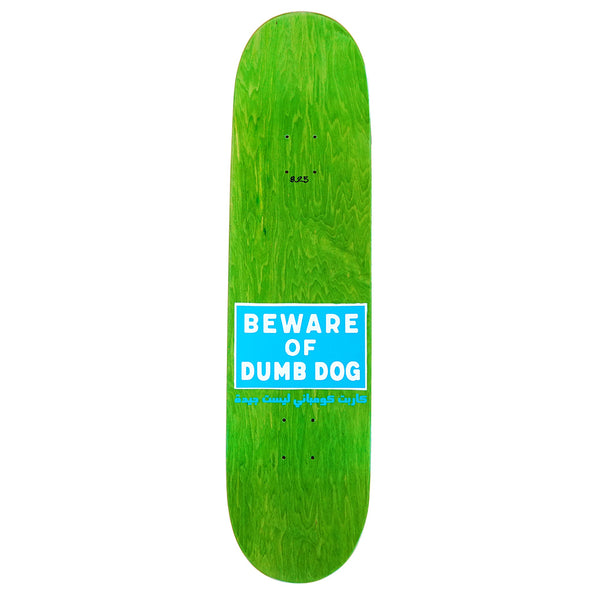 The CARPET DUMB DOG skateboard deck by Carpet Co. features hand-screened green vinyl with "BEWARE OF DUMB DOG" in white and blue, plus smaller script below. This limited edition deck stands out for its unique style.