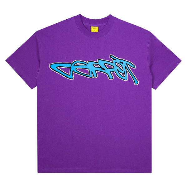 The Carpet Co. Freestyle Tee Purple is a cotton t-shirt with "Carrot" in blue graffiti-style lettering across the chest.