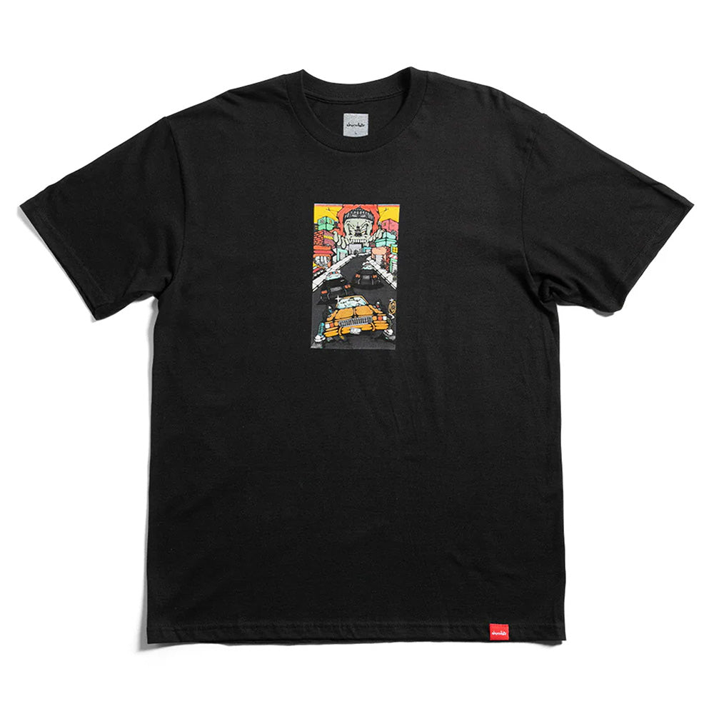 The CHOCOLATE FIEND STREET TEE BLACK by CHOCOLATE features a vibrant city street graphic and large face on the chest, crafted from soft ring spun cotton for a modern classic fit.