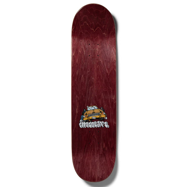 The CHOCOLATE HERRERA FIENDIN' deck by CHOCOLATE features a maroon design with a small yellow car graphic and "Chocolate" text, ideal for fans of classic style and quality skateboard decks.