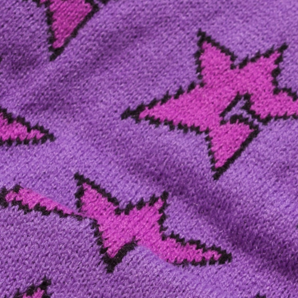 A close up of a Carpet Co. C-Star Beanie Purple sock with stars on it.