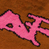A CARPET NO FOLD BEANIE BROWN sweater with a pink f on it.