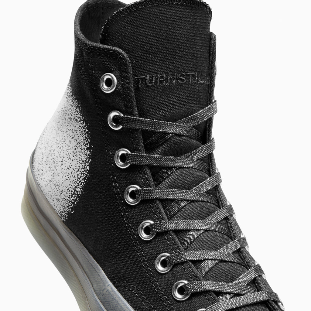 The CONVERSE x TURNSTILE CHUCK 70 HI BLACK / GREY / WHITE is a classic sneaker that embodies the iconic style of Converse. With its timeless design and durable construction, this shoe is perfect for everyday wear. Whether you're