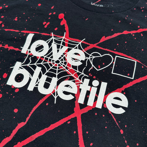 A black tee with the words "LOVE BLUETILE HALLOWEEN" on it from Bluetile Skateboards.