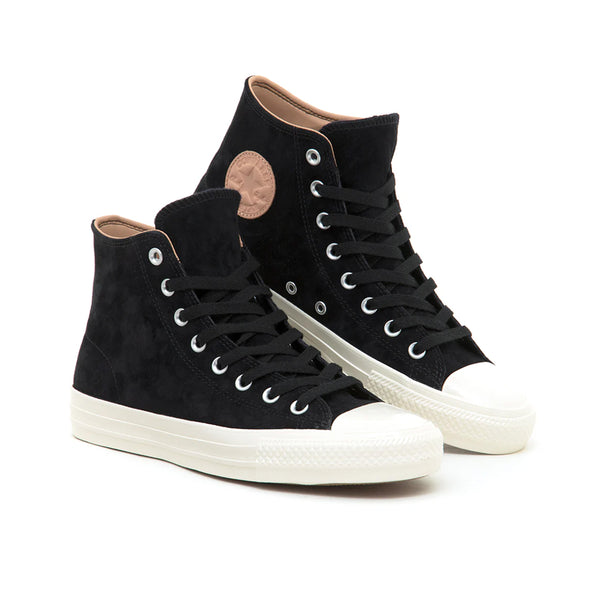 The Converse CONS Chuck Taylor All Star Pro Nubuck in Black/Vachetta Beige features a black nubuck upper with white rubber soles and laces, a signature round side patch, and skateboarding cushioning for style and support.