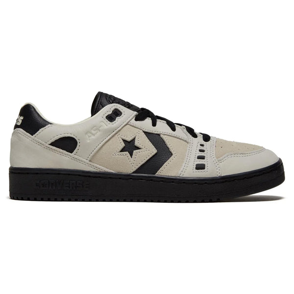 Side view of a CONVERSE CONS ALEXIS AS-1 PRO EGRET / BLACK skateboarding shoe with beige upper, black sole, and black star logo on the side.