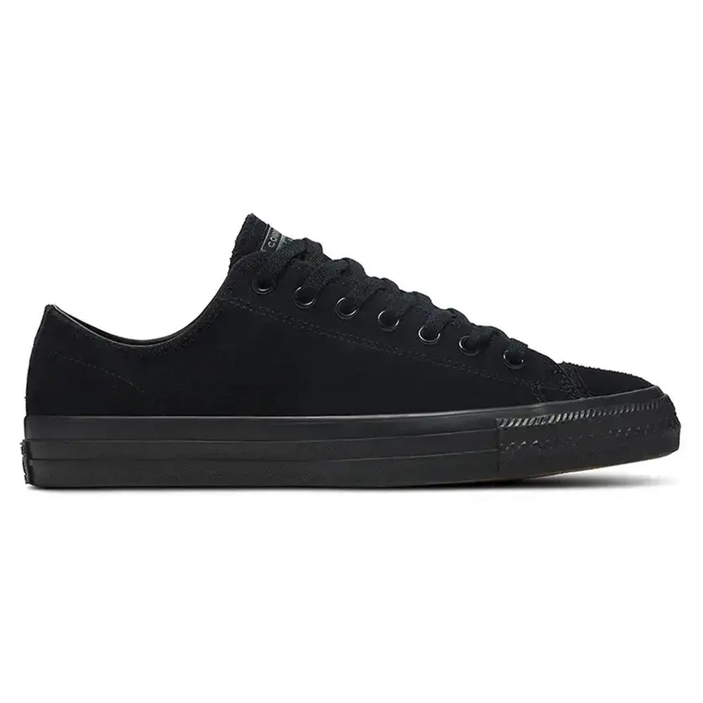 All-black low-top CONVERSE CONS CHUCK TAYLOR ALL STAR PRO OX SUEDE BLACK / BLACK sneaker with black laces, rubber sole, and minimalist design. Enhanced for performance as a skateboarding shoe with CX foam cushioning for added comfort.