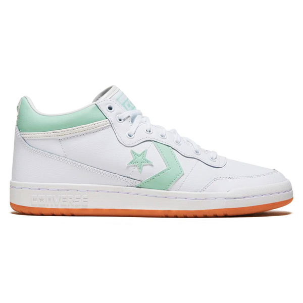 White Converse CONS Fastbreak Pro Mid Leather sneaker with a deep emerald star logo and matching heel accent, featuring a gum sole.