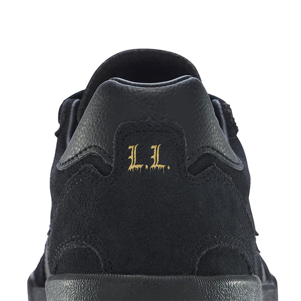 Close-up rear view of the CONVERSE CONS LOUIE LOPEZ PRO 2 SUEDE BLACK / GUM skate shoe, featuring "L.L." in gold on the heel.