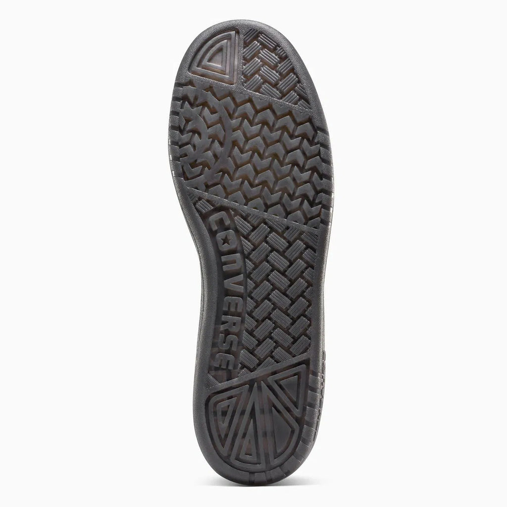 The CONVERSE CONS REMY TAVEIRA FASTBREAK PRO MID BLACK / BLACK shoe features a unique wavy tread pattern with "Converse" embossed on the sole and includes CX cushioning for enhanced comfort.