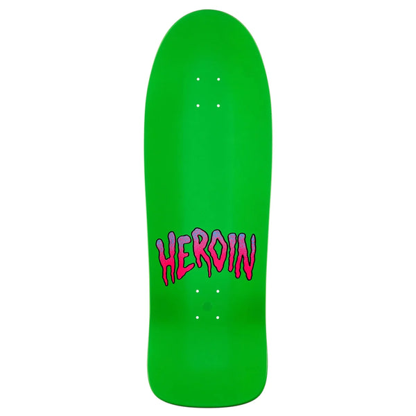 The HEROIN CURB CRUSHER CHOMP skateboard deck (10.25", green, 7 Ply North American Hard Rock Maple) showcases bold, pink "HEROIN" lettering—a striking design by the HEROIN brand.