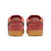 A pair of University Red and green nike NIKE SB DUNK LOW PRO BURNT SUNRISE / VINTAGE GREEN sneakers viewed from the back, featuring "Nike" text on the heel and gum-colored soles, with a comfortable foam midsole.